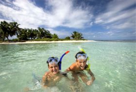 Kids enjoying the Caribbean off the private island belonging to The Placencia, Placencia, Belize – Best Places In The World To Retire – International Living